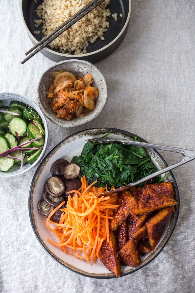 Korean-Style Seoul Bowl- with Gochujang baked Tempeh, steamed veggies, kimchi and pickled cucumber- a healthy vegan version of Bibimbap! | www.feastingathome.com