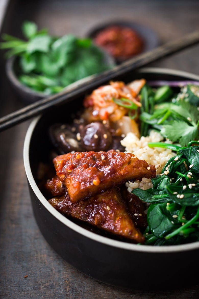 Korean-Style Seoul Bowl- with Gochujang baked Tempeh, steamed veggies, kimchi and pickled cucumber- a healthy vegan version of Bibimbap!