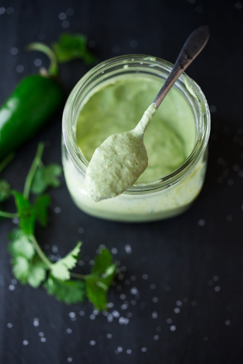Vegan Cilantro Crema - nut-free, made with silken tofu. Rich and creamy without a whole lot of calories or dairy. Spoon it over tacos, enchiladas or even baked potatoes ....you'll find a million things to do with it! | www.feastingathome.com #vegancilantrocream