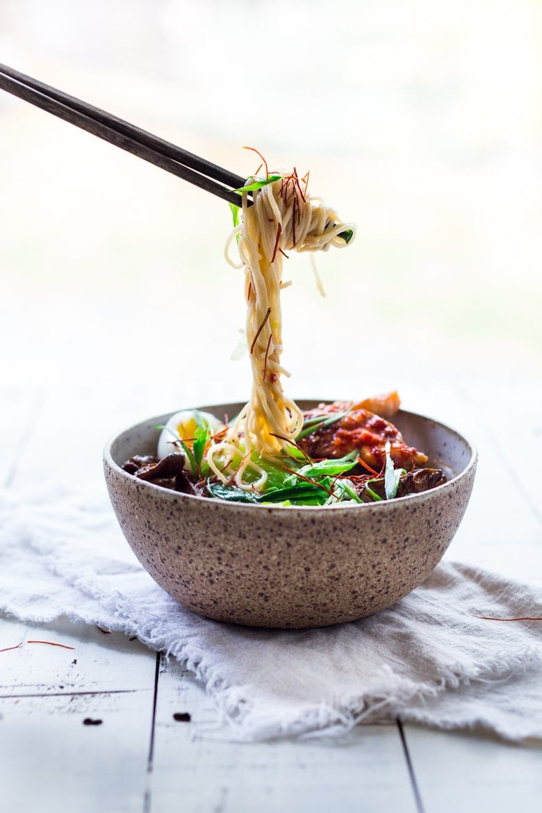 Simple Spicy Miso Ramen w/ Roasted Chili Salmon ( or tofu!) with bok choy, mushrooms and scallions. Vegan and Paleo adaptable! Swap out zucchini noodles or kelp noodles to keep it Paleo! Make in 20 minutes! | www.feastingathome.com