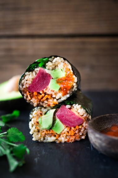 Delicious, easy Sushi Burritos! Sushi Rice, avocado, ahi, (or salmon or tofu) and veggies, wrapped up with Nori into a tasty healthy burrito!