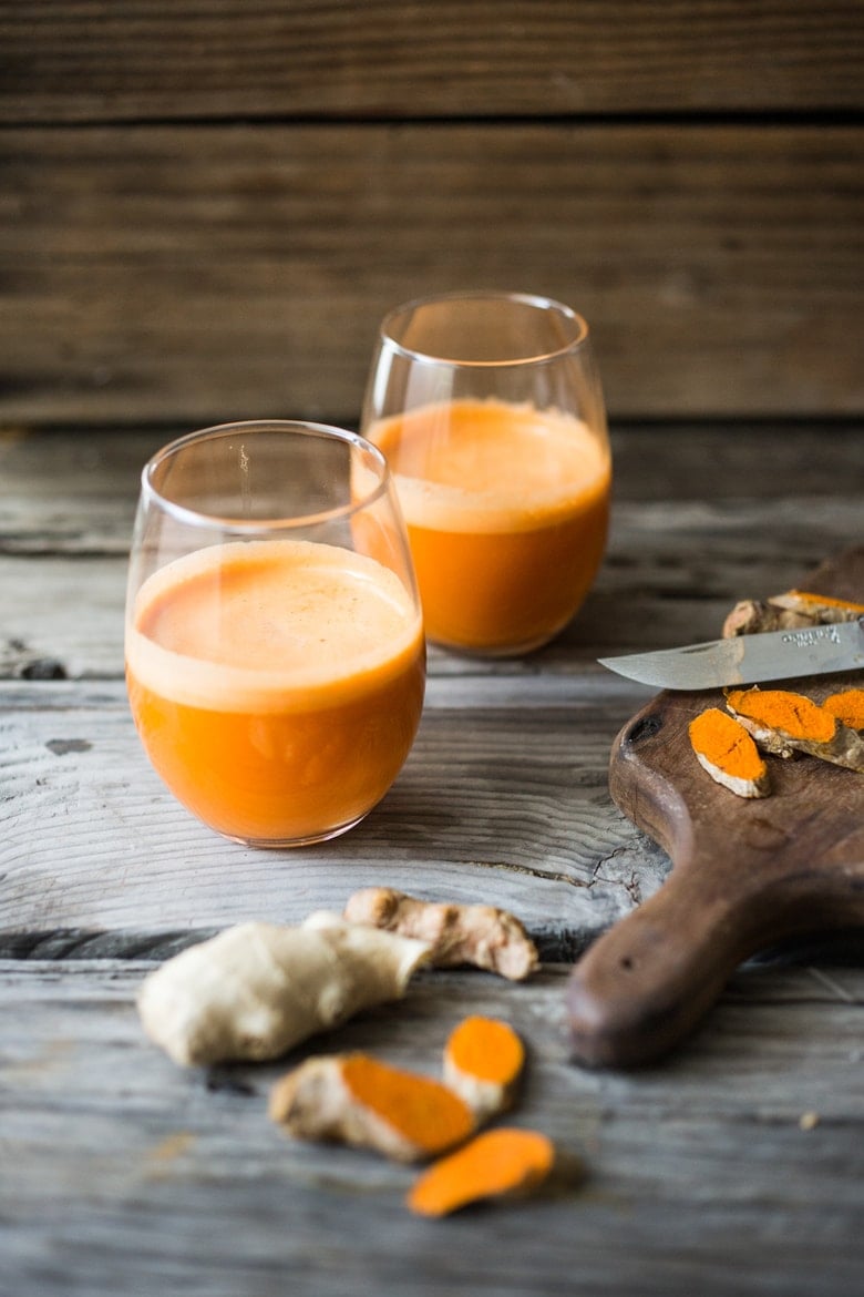 Turmeric Golden Root juice - a fresh juice harnessing the power of turmeric root - to soothe inflammation, aid in cleansing the body and fight illness. | www.feastingathome.com