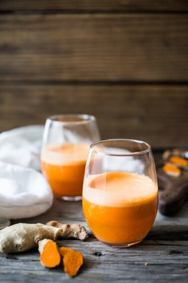 This fresh carrot juice is loaded up with fresh turmeric root, ginger and apple- a healthy, lightly sweetened juice full of healing nutrients! 