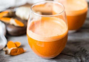 Turmeric Golden Root juice - a fresh juice harnessing the power of turmeric root - to soothe inflammation, aid in cleansing the body and fight illness. | www.feastingathome.com