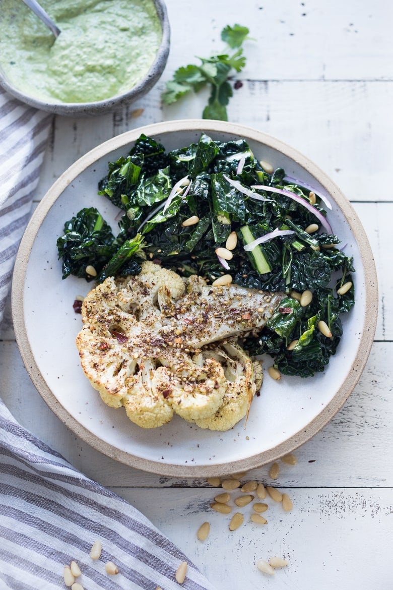  Zaatar Roasted Cauliflower Steaks with Green Tahini Sauce - a simple delicious vegan meal full of Middle Eastern flavor that can be made in 35 minutes. | www.feastingathome.com