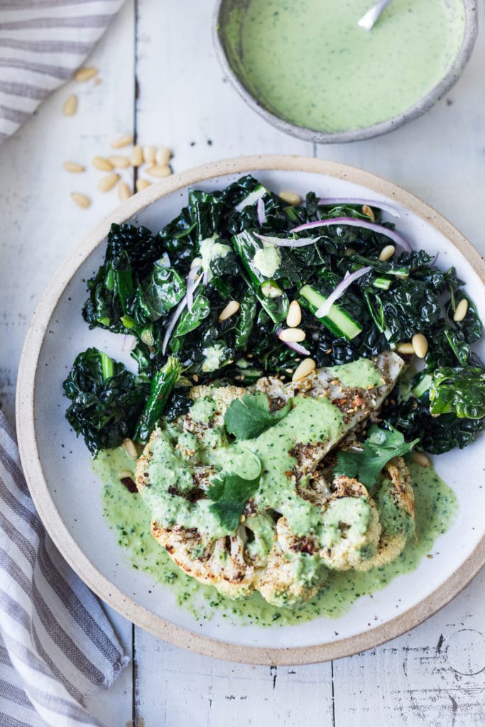 Middle Eastern Zaatar Roasted Cauliflower Steaks with Green Tahini Sauce. Vegan and Gluten-free!