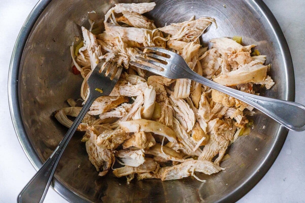 Shredded chicken in a bowl. 