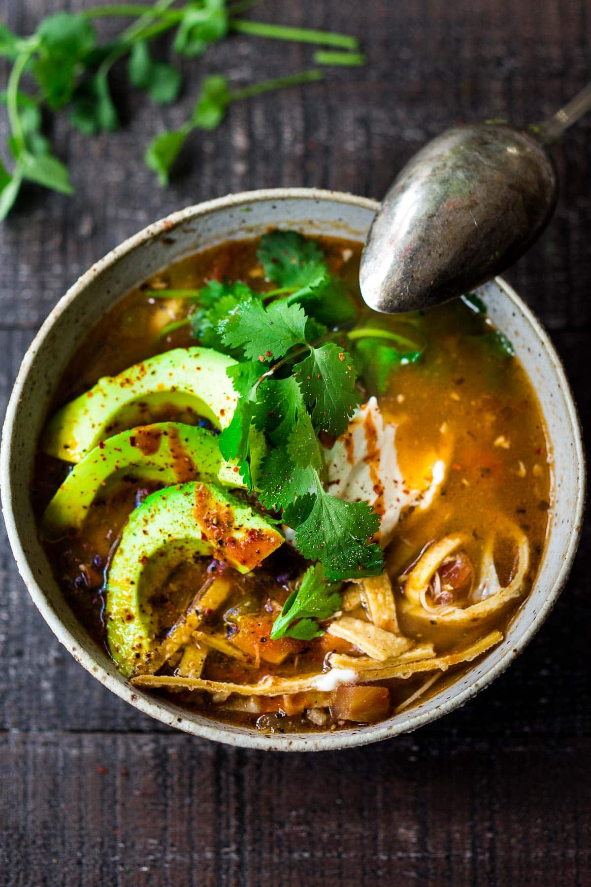 Chicken Tortilla Soup in a bowl with all the toppings.