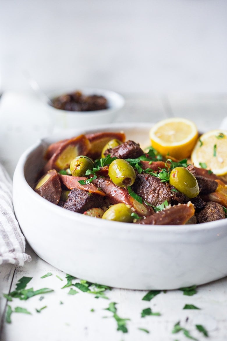 Meltingly tender, this Morrocan Instant Pot Lamb Tagine is aromatic and flavorful and so easy to make using an Instant pot or pressure cooker . Serve it over Basmati Rice, Cous Cous or Everyday Quinoa and optional Tfaya for a hearty delicious meal.