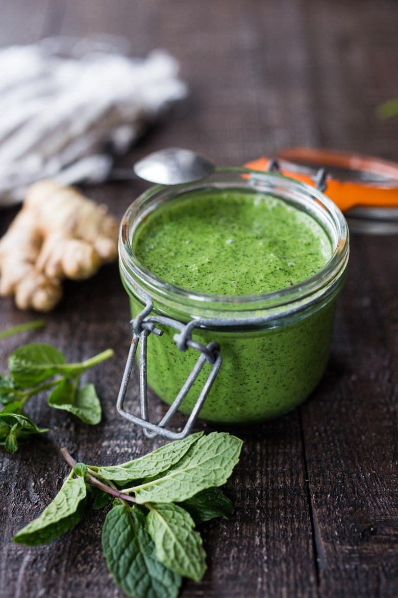 Cilantro Mint Chutney is a delicious condiment served with Indian cuisine. It's herby, bright, slightly spicy and tastes incredibly vibrant, made with fresh mint, chilies, ginger and garlic. Make it in 5 minutes flat using your blender or food processor. Gluten-free & vegan-adaptable, includes a video. 