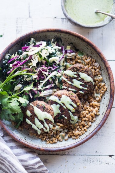 Vegan Lentil Patties made with walnuts and mushrooms topped with flavorful Zhoug yogurt.