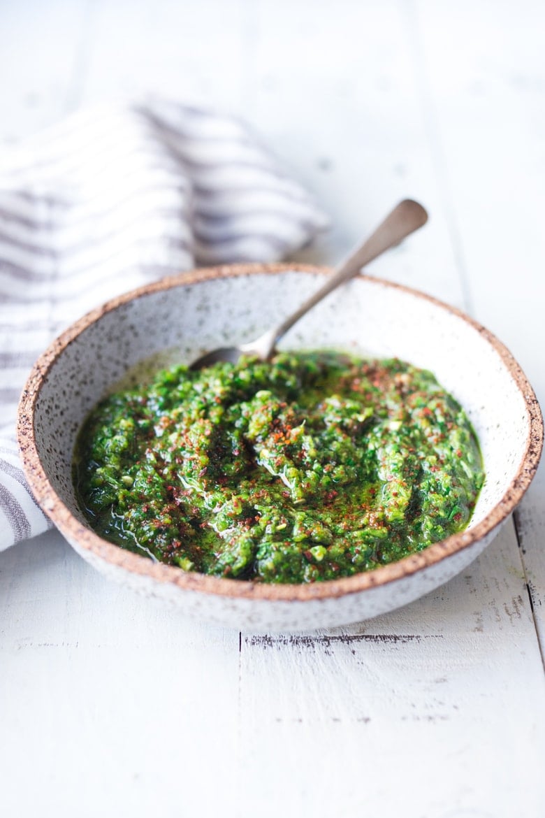 Zhoug Sauce Recipe - a flavorful Middle Eastern Cilantro Sauce that gives meals a huge burst of flavor. Simple easy recipe that can be made in 5 minutes flat! | #zhoug #zhougrecipe #howtomakezhoug www.feastingathome.com