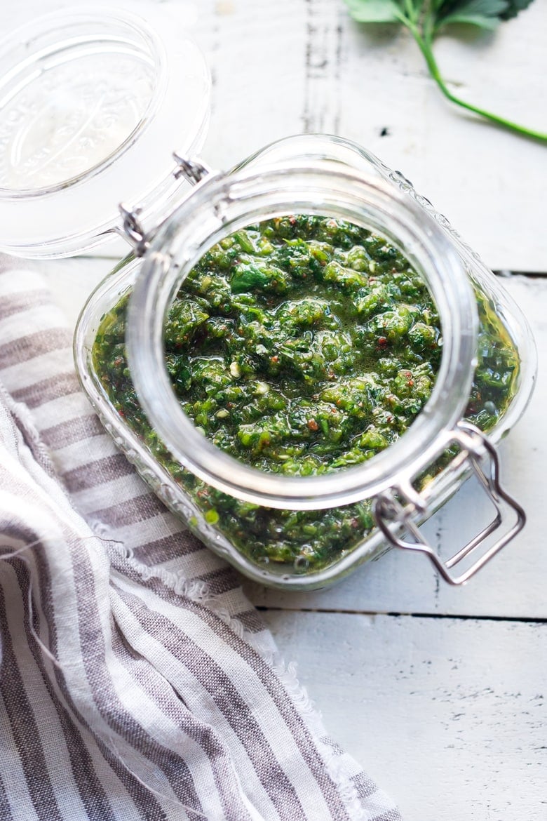 Zhoug Sauce Recipe - a flavorful Middle Eastern Cilantro Sauce that gives meals a huge burst of flavor. Simple easy recipe that can be made in 5 minutes flat! | #zhoug #zhougrecipe #howtomakezhoug www.feastingathome.com