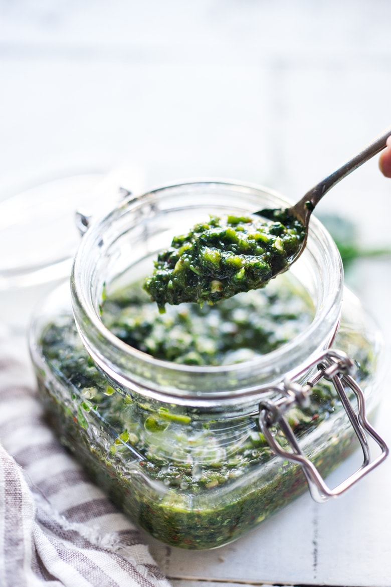 Zhoug Sauce Recipe - a flavorful Middle Eastern Cilantro Sauce that gives meals a huge burst of flavor. Simple easy recipe that can be made in 5 minutes flat! | #zhoug #zhougrecipe #howtomakezhoug www.feastingathome.com