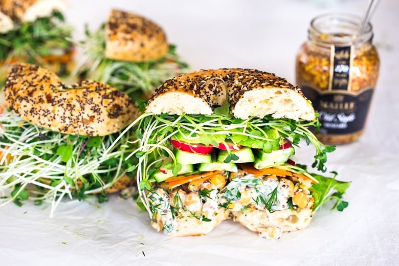 Vegan Green Goddess Sandwich with herby chickpea salad, crunchy carrots & radishes, cucumber, avocado and sprouts. Vegan and Gluten-free adaptable!