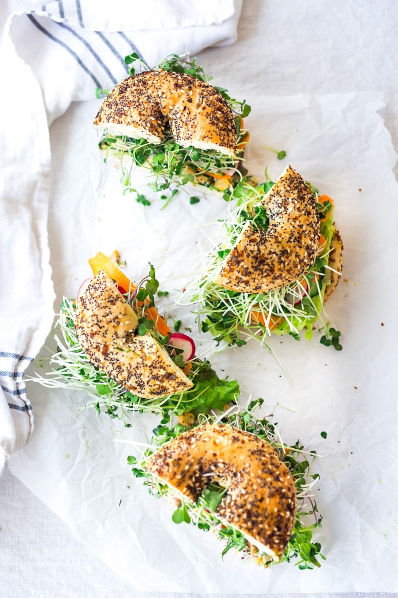 Vegan Green Goddess Sandwich with herby chickpea salad, crunchy carrots & radishes, cucumber, avocado and sprouts. Vegan and Gluten-free adaptable!