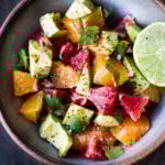A simple delicious recipe for Orange and Avocado Salad with Lime juice, chili flakes and cilantro.