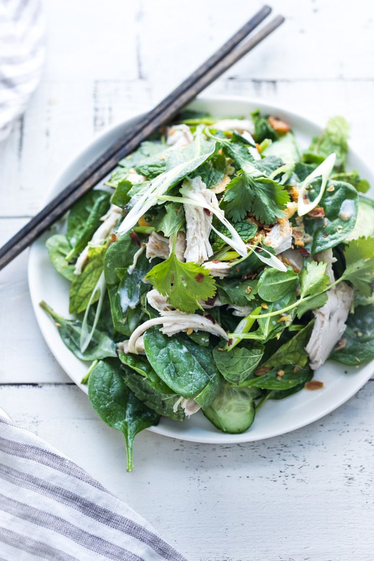 Thai Chicken Salad with baby spinach, spring herbs and scallions. A flavorful Thai-inspired Entree Salad. #coconutchicken #coconut #spinachsalad #thaisalad
