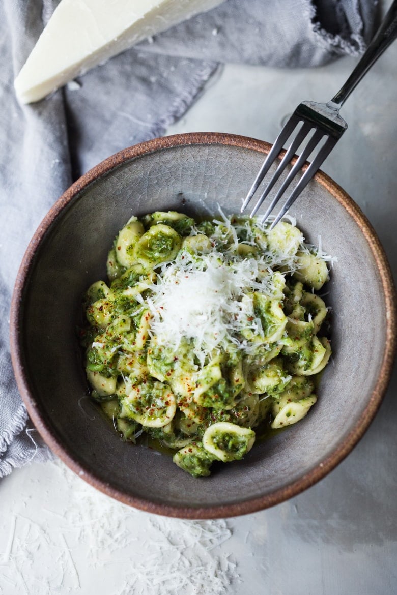 Broccoli pasta recipe (called pasta con broccoli) in a bowl with pecorino cheese.