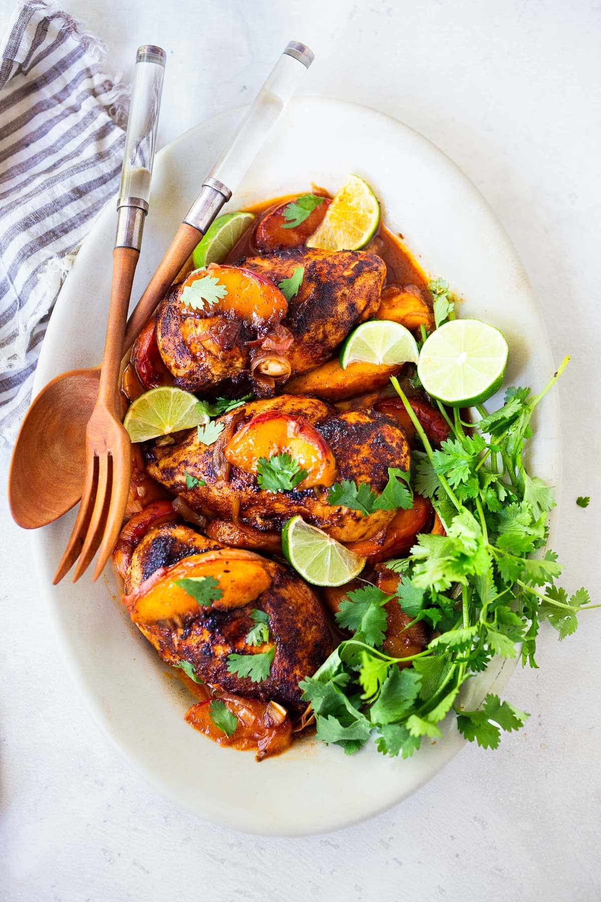 This peach chicken recipe is fast and easy and highlights fresh, juicy summer peaches! Made with chicken breasts or thighs, with savory, smoky Mexican spices. Grill it or pan-sear it- either way, you'll love it!