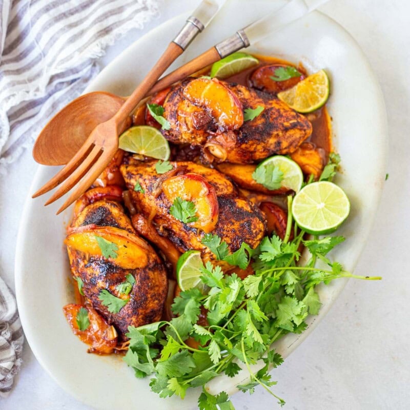 This peach chicken recipe is fast and easy and highlights fresh, juicy summer peaches! Made with chicken breasts or thighs, with savory, smoky Mexican spices. Grill it or pan-sear it- either way, you'll love it!