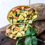 Vegan Curry Tofu Salad Wrap- Turn it into a hearty wrap, stuff into an avocado or served over a bowl of baby spinach. Flavorful and healthy! | www.feastingathome.com #currytofu