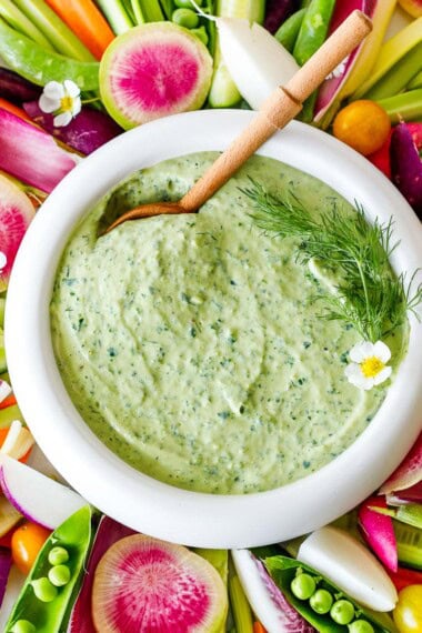 This green goddess salad dressing is so creamy and flavorful, you'll hardly know it's vegan! Made with fresh herbs, miso paste, and silken tofu! Easy to whip up and full of punchy herby flavor.