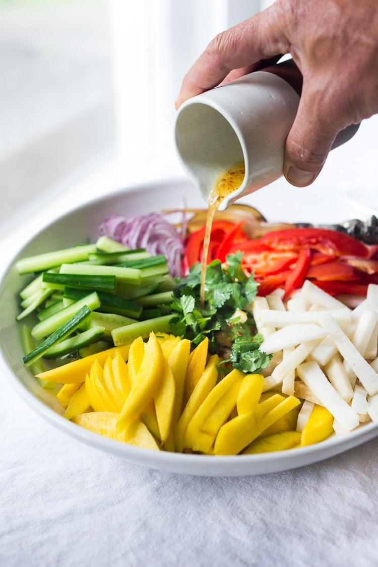 Jicama Salad with Mango, Cucumber, Avocado, Lime and Aleppo Chile Flakes - a delicious healthy side dish that pairs well with grilled chicken and fish. Perfect for alfresco dining, outdoor gatherings, barbecues and potlucks!  #potluck #mangosalad #jicamasalad #potluckideas #vegan #jicama