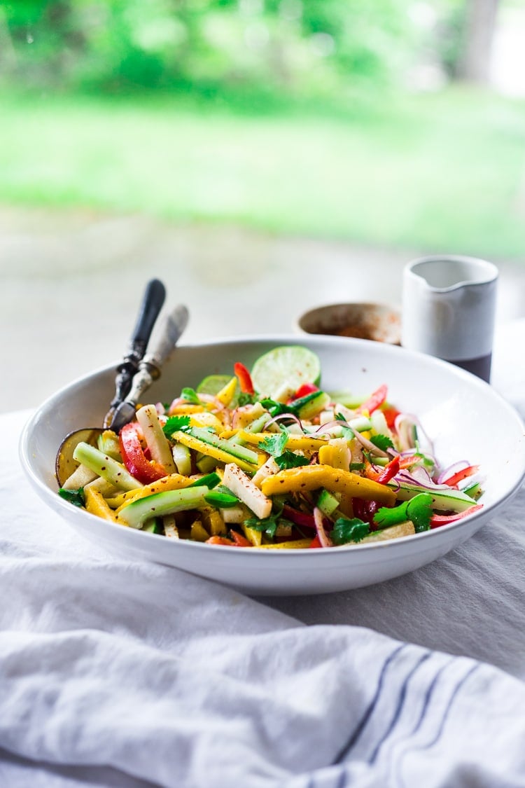 Jicama Salad with Mango, Cucumber, Avocado, Lime and Aleppo Chile Flakes - a delicious healthy side dish that pairs well with grilled chicken and fish. Perfect for alfresco dining, outdoor gatherings, barbecues and potlucks!  #potluck #mangosalad #jicamasalad #potluckideas #vegan #jicama