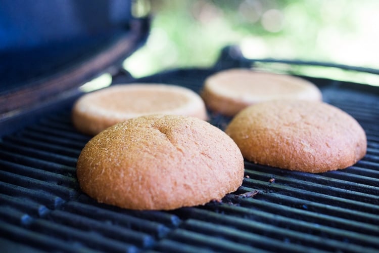 wheat buns, face down, grilling.