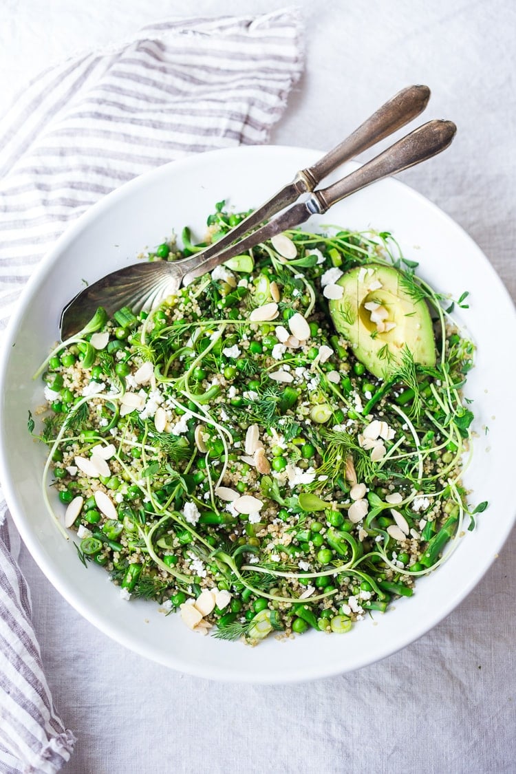 This recipe for Quinoa Asparagus Salad is like "Spring Tabouli" - it's tossed with fresh peas, parsley, fresh dill, lemon, sliced almonds, avocado and optional goat or feta cheese. A healthy, vegan-adaptable salad that can be made ahead- perfect for barbecues, potlucks and outdoor gatherings. #quinoa #asparagus #tabouli