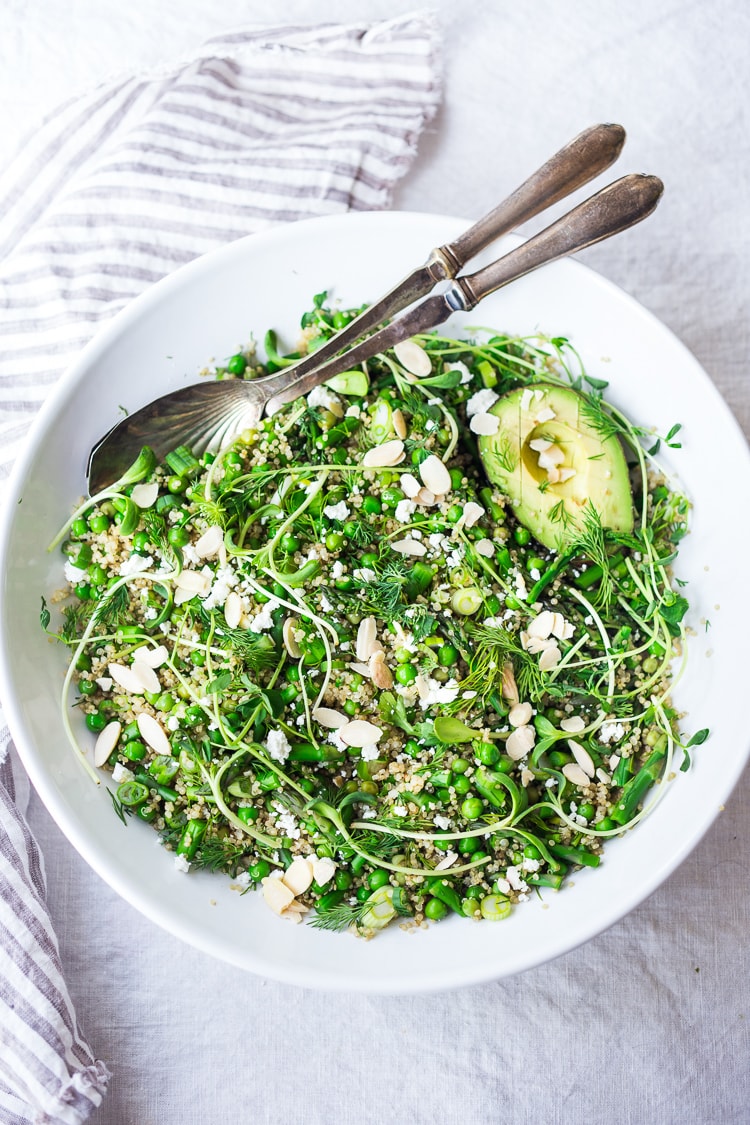 This recipe for Quinoa Asparagus Salad is like "Spring Tabouli" - it's tossed with fresh peas, parsley, fresh dill, lemon, sliced almonds, avocado and optional goat or feta cheese. A healthy, vegan-adaptable salad that can be made ahead- perfect for barbecues, potlucks and outdoor gatherings. #quinoa #asparagus #tabouli