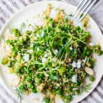 A simple recipe for Quinoa Asparagus Salad (aka Spring Tabouli) tossed with English peas, fresh dill, parsley, toasted almonds in a lemony dressing topped with optional avocado, goat or feta cheese. A healthy, flavorful salad that can be made ahead- perfect for special gatherings or midweek lunches! GF &  Vegan adaptable! 