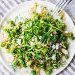 A simple recipe for Quinoa Asparagus Salad (aka Spring Tabouli) tossed with English peas, fresh dill, parsley, toasted almonds in a lemony dressing topped with optional avocado, goat or feta cheese. A healthy, flavorful salad that can be made ahead- perfect for special gatherings or midweek lunches! GF & Vegan adaptable!