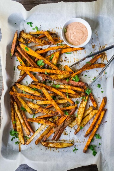 These Sweet Potato Fries can be baked in the oven, or in your air fryer. Healthy, easy and oh-so crispy! Vegan.