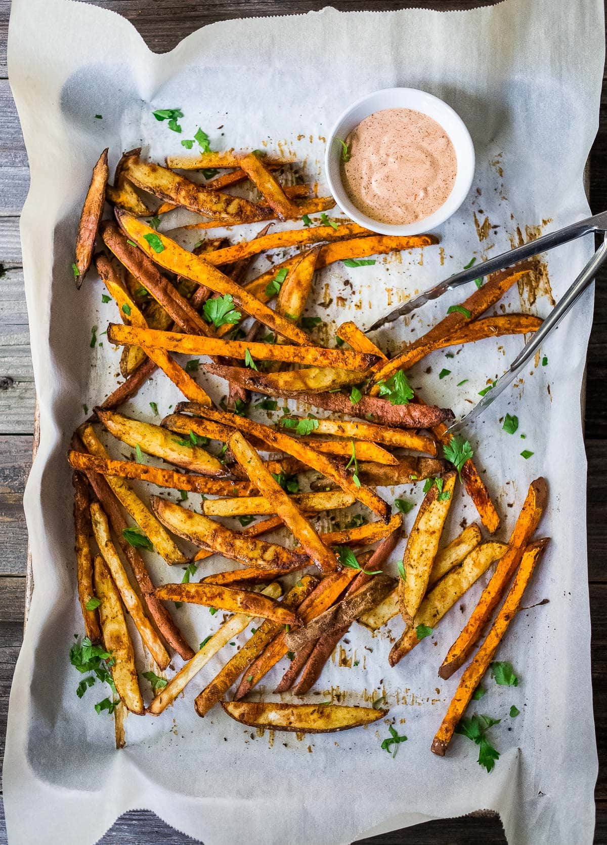 These Sweet Potato Fries can be baked in the oven, or in your air fryer. Healthy, easy and oh-so crispy! Vegan.