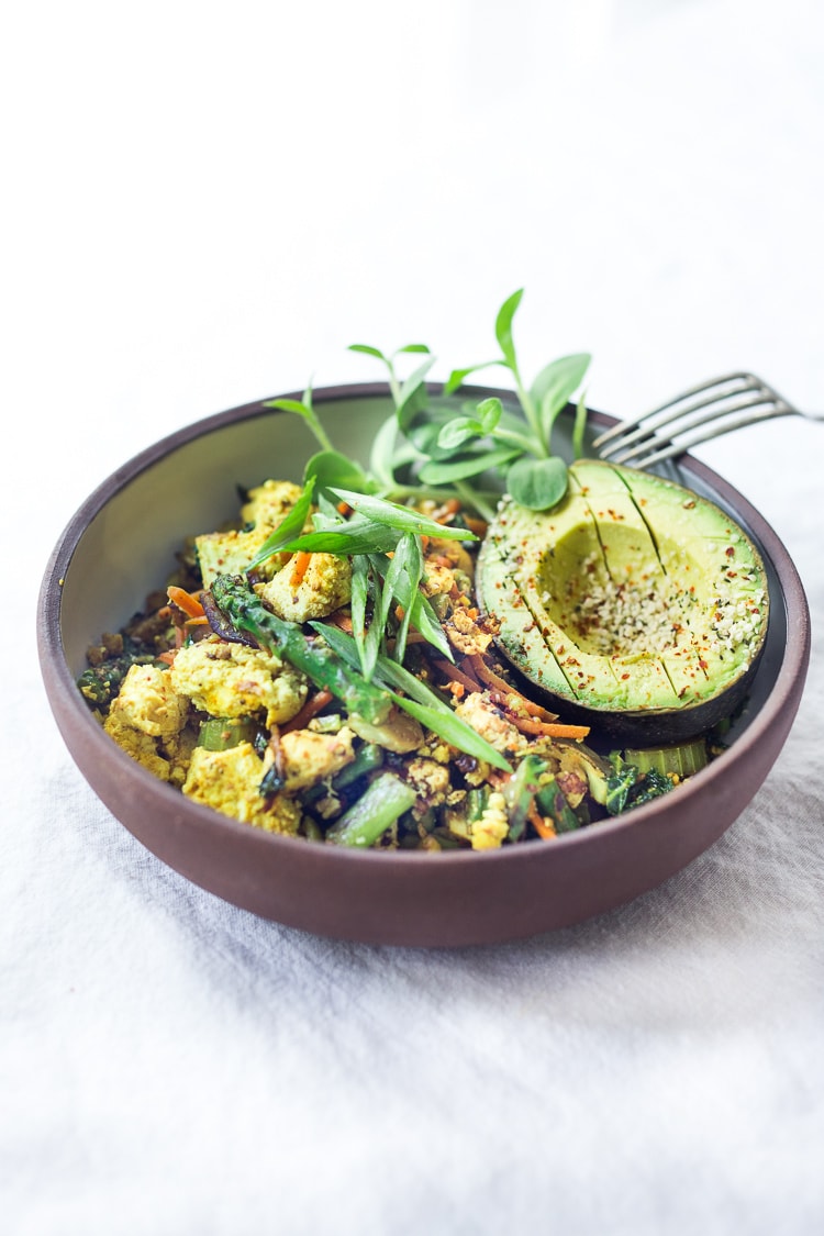 Vegan Tofu Scramble - loaded up with healthy seasonal veggies that you already have on hand. This vegan breakfast can be made in 15 minutes flat! Healthy, Fast, delicious! #vegan #veganbreakfast #tofuscramble #plantbased #eatclean #cleaneating #cleaneats 