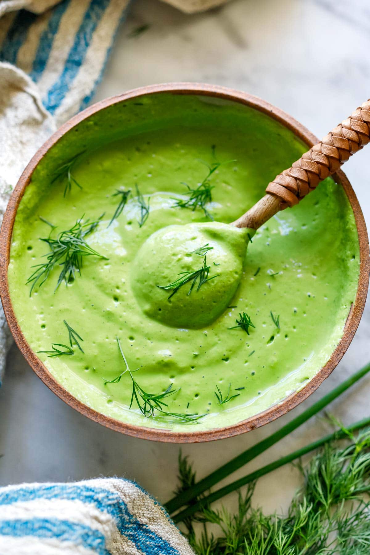 This green goddess salad dressing is so creamy and flavorful, you'll hardly know it's vegan! Made with fresh herbs, miso paste, and silken tofu! Easy to whip up and full of punchy herby flavor.