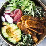 Vegan Kale Salad with Blackened Tempeh, Avocado, radishes, micro greens, pickled onions and a creamy VEGAN Cajun Ranch Dressing.