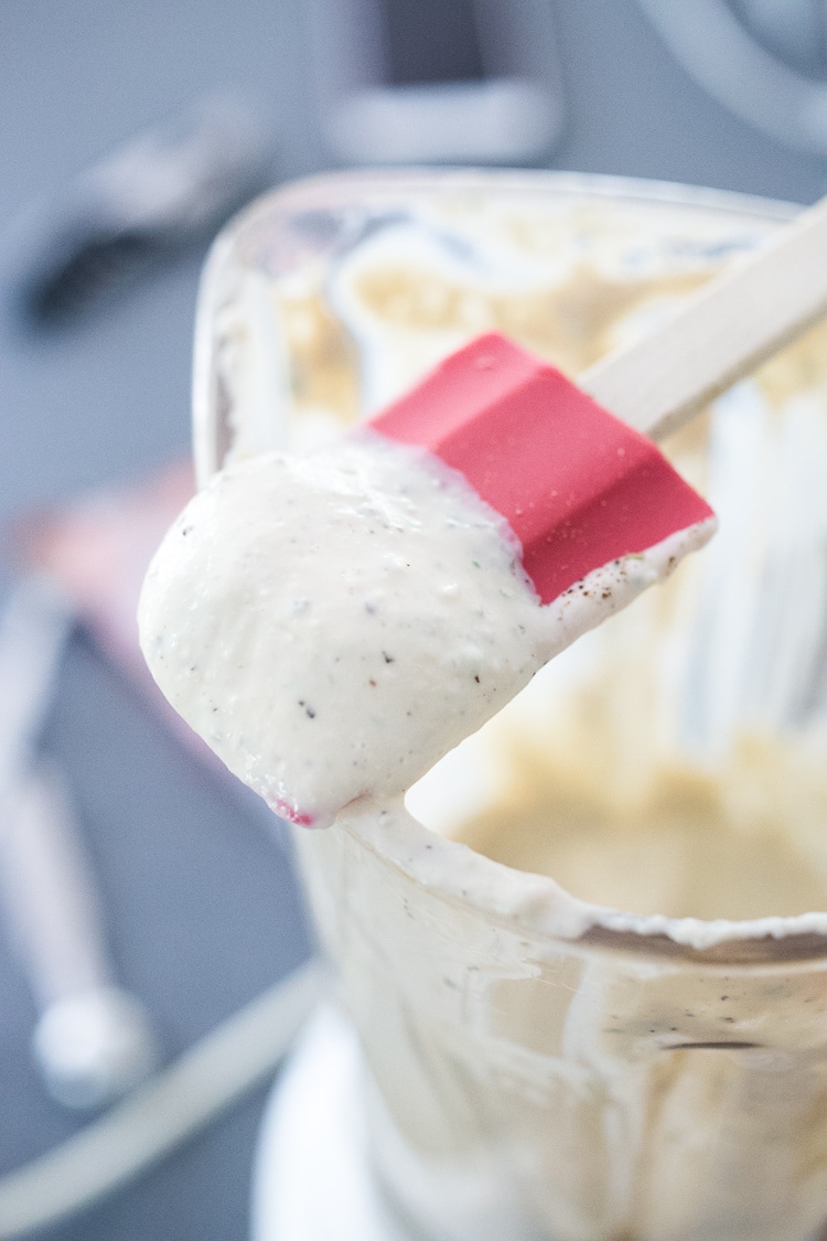 creamy vegan ranch in a blender with a spatula
