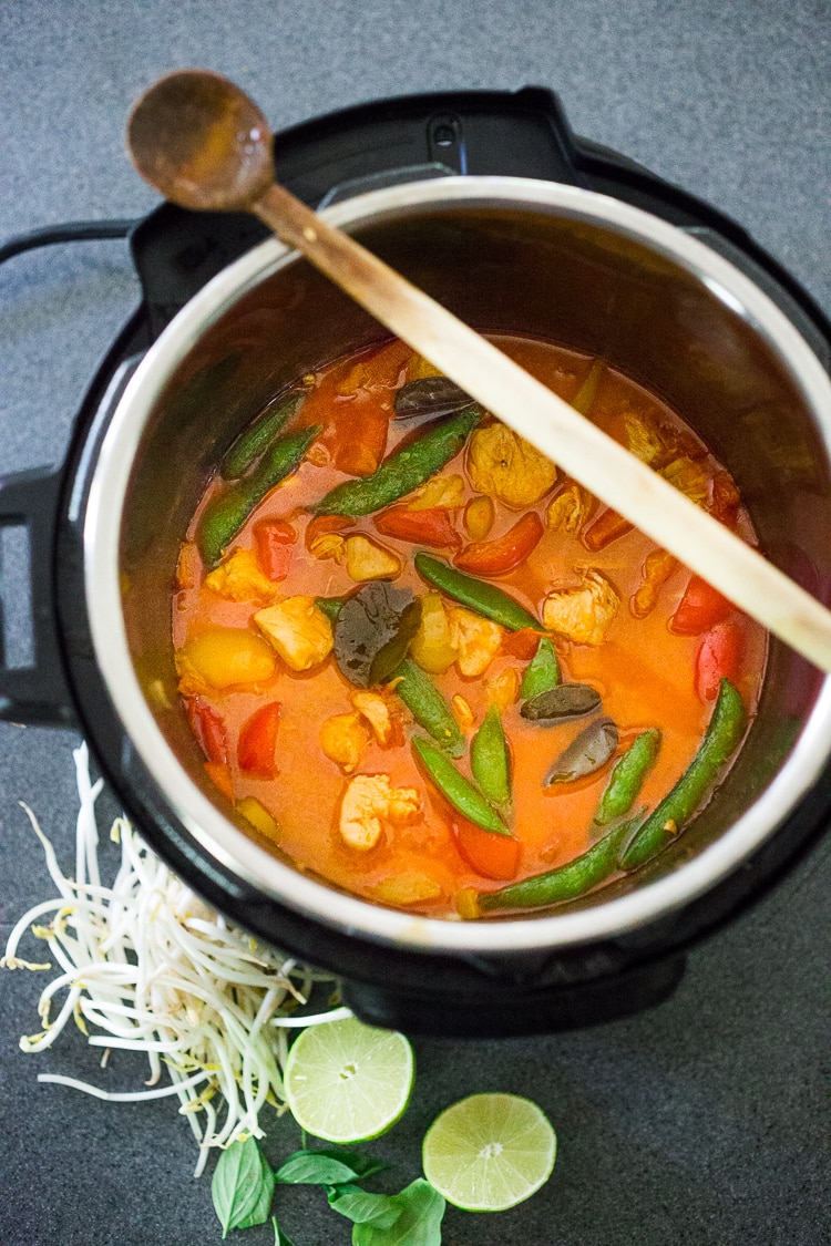 A simple delicious recipe for Instant Pot Thai Curry Chicken,  loaded up with your favorite seasonal veggies! This flavorful meal can be made in 25 minutes!  Serve it over rice, quinoa or even rice noodles - and save the leftovers for lunch! #instantpot #instantpotrecipes #instantpotchicken #instantpotchickencurry #thaicurrychicken 