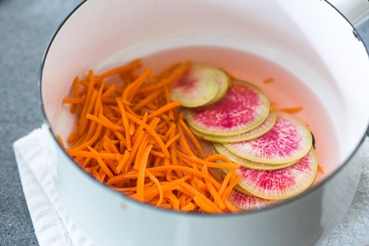 Fresh and delicious Vegan Bahn Mi Noodle Bowls with Sriracha Tofu, rice noodles, pickled carrots and radishes, crunchy cucumber and cabbage and a creamy vegan spicy Bahn Mi dressing! #bahnmi #healthybowl #noodlebowl #vegan #veganbowl #bahnmibowl #noodles