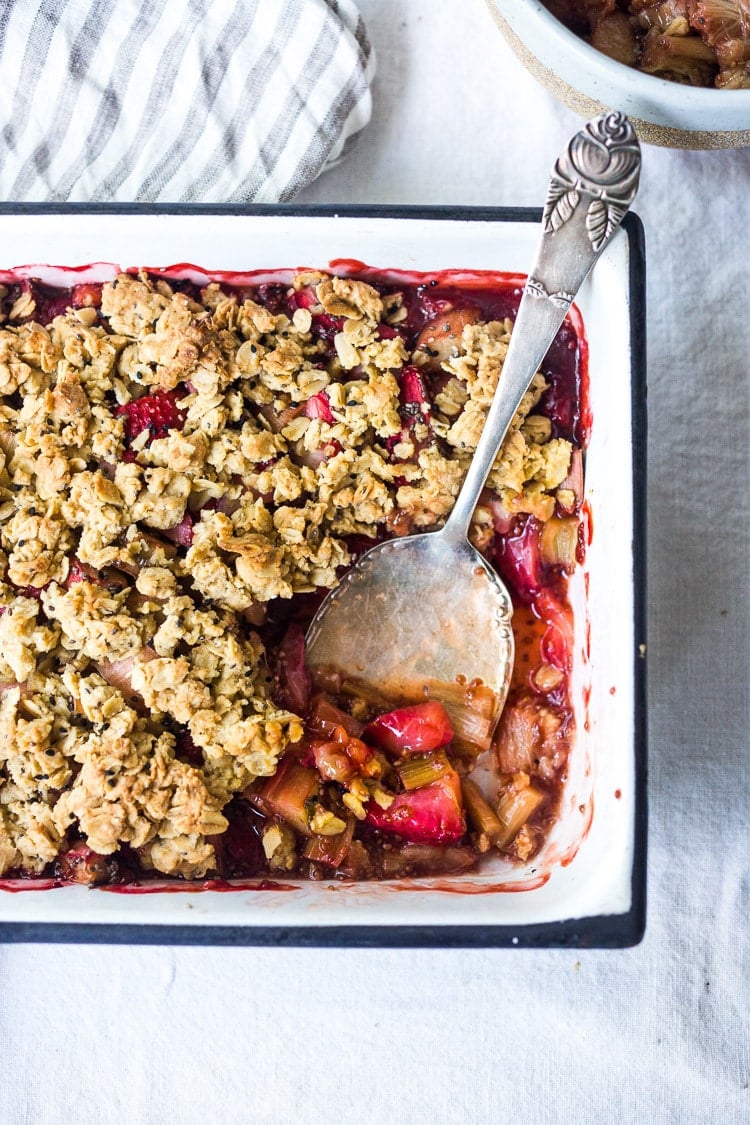Maple-Sweetened Strawberry Rhubarb Crisp with Chia Seeds and a crumbly oat topping - a vegan, gluten-free dessert that highlights spring rhubarb. #vegan #glutenfree #crisp #rhubarb #rhubarbcrisp #rhubarbrecipes