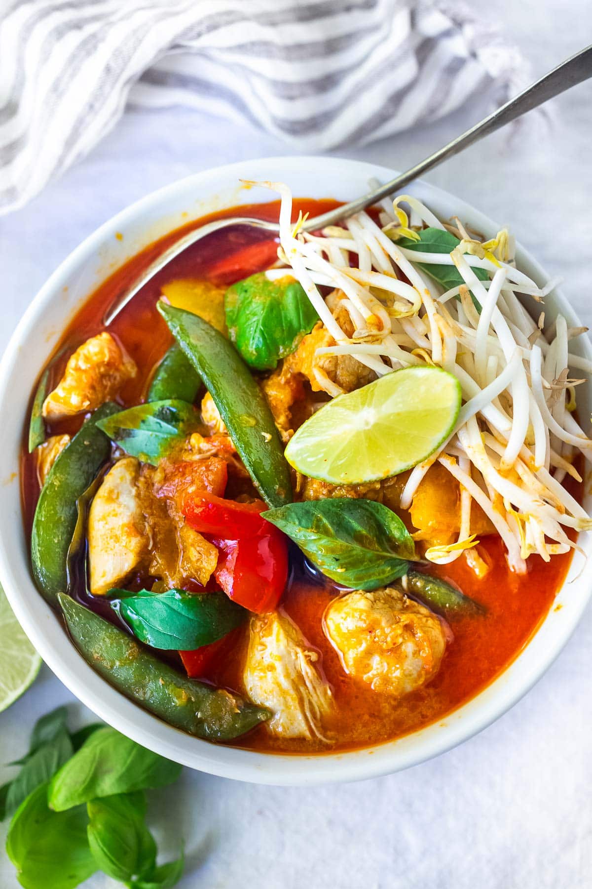 This Thai Red Curry recipe is bursting with authentic Thai flavor and can be made in 30 minutes on the stove or in your Instant Pot!  A quick and easy dinner recipe the whole family will love. Serve it with jasmine rice and save the amazing leftovers for lunch! Vegetarian-adaptable.