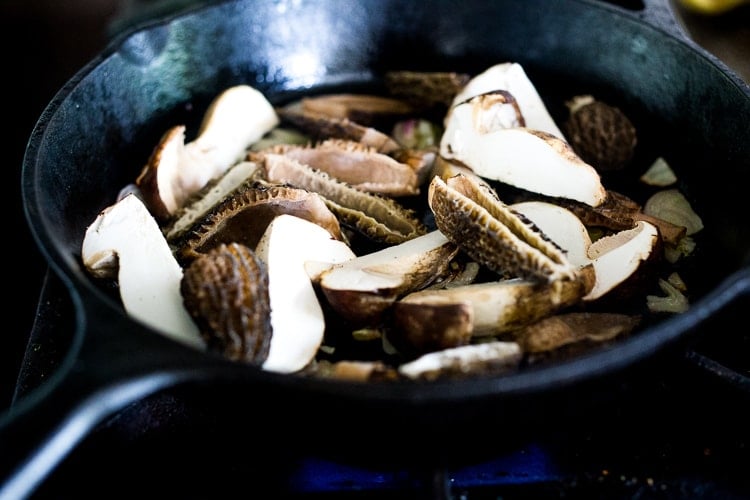 sautéed morel mushrooms in cast iron skillet.