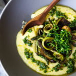 A simple elegant recipe for Creamy Polenta with Spring Veggies and Gremolata - flavorful and healthy featuring vibrant spring produce that can be made in under 30 minutes. Vegan & Gluten Free! #creamypolenta #vegan #springrecipes #asparagus #fiddleheadferns #morel #porcini #softpolenta #veganpolenta