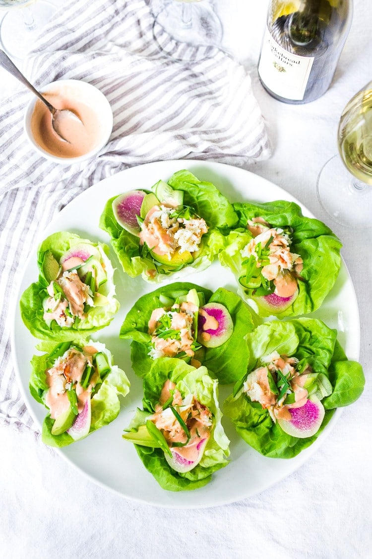 Mini Crab Louie! Served in a fresh butter lettuce wrap with radish and avocado. Fresh and light, these flavorful appetizers are always the hit of the party! #crab #crablouise #appetizer #lettucewraps