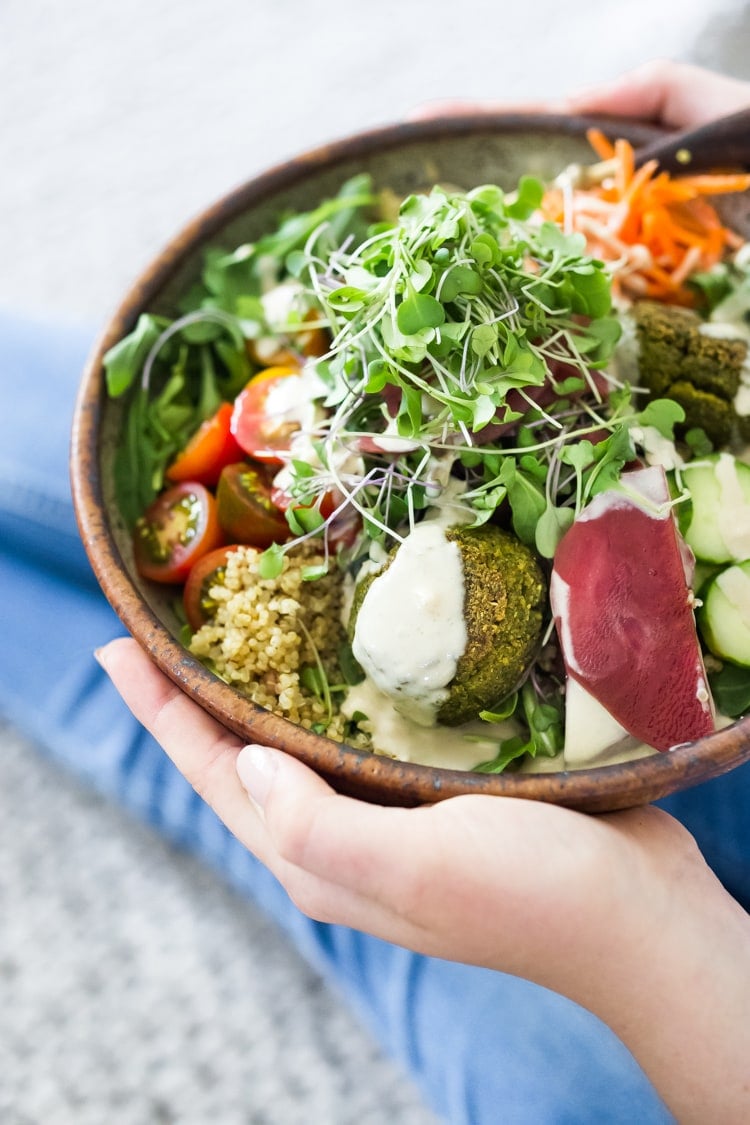 Our 25 BEST Vegan Buddha Bowls!| Like this...Baked Falafel Bowl! Meal-prep these authentic falafels and freeze for the busy workweek. Serve with warm grains or grains, fresh or roasted veggies and tahini sauce! Vegan and Gluten-free! #buddhabowl #veganbowl #veganbowls #buddhabowls #falafelbowl #easyfalafel #bakedfalafels #bakedfalafel #falafelsalad #cleaneating #eatclean #plantbased #detox