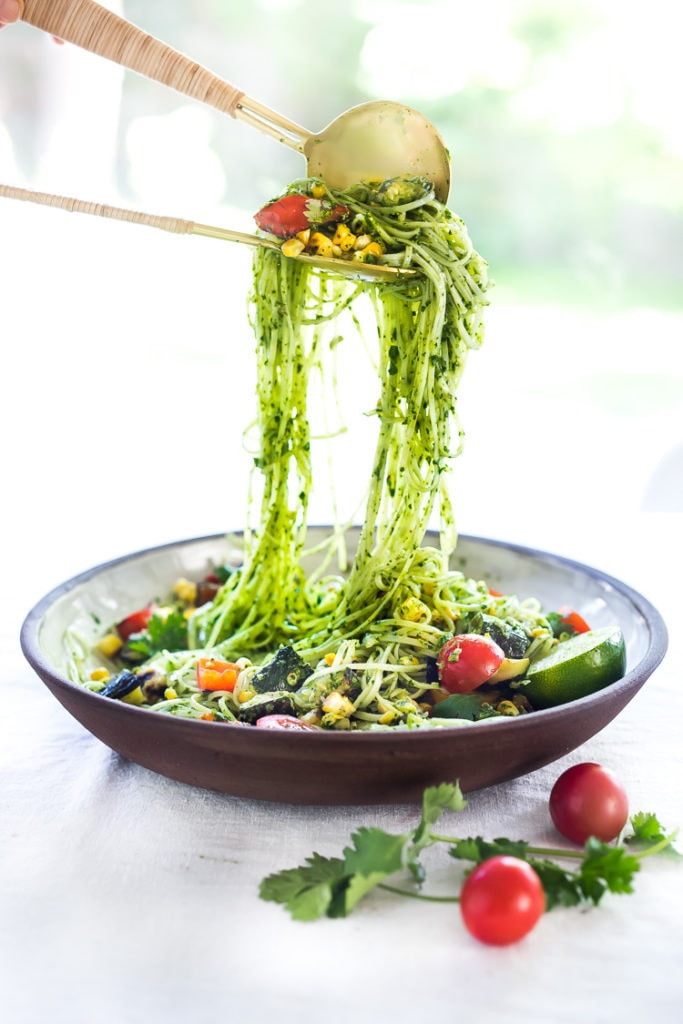 Summer Pasta Salad w/ Grilled Zucchini, Corn and Cilantro Pesto is made with gluten-free rice noodles and loaded up with healthy summer veggies, then tossed in the most flavorful Cilantro Pesto.... deliciously addicting! Vegan and Gluten-free! #summerpastasalad #pastasalad #cornpasta #cilantropesto #zucchinipasta #zucchini #potluck