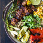 Healthy, Easy, Chipotle Grilled Chicken Salad with Grilled Corn, Peppers and Arugula, over a bed of optional quinoa with grilled scallions, avocado and a simple Chipotle Lime Dressing. Sub MEXICAN TOFU for the Chicken for a vegan version! #chipotlechicken #mexicansalad #chickensalad #grilledchicken
